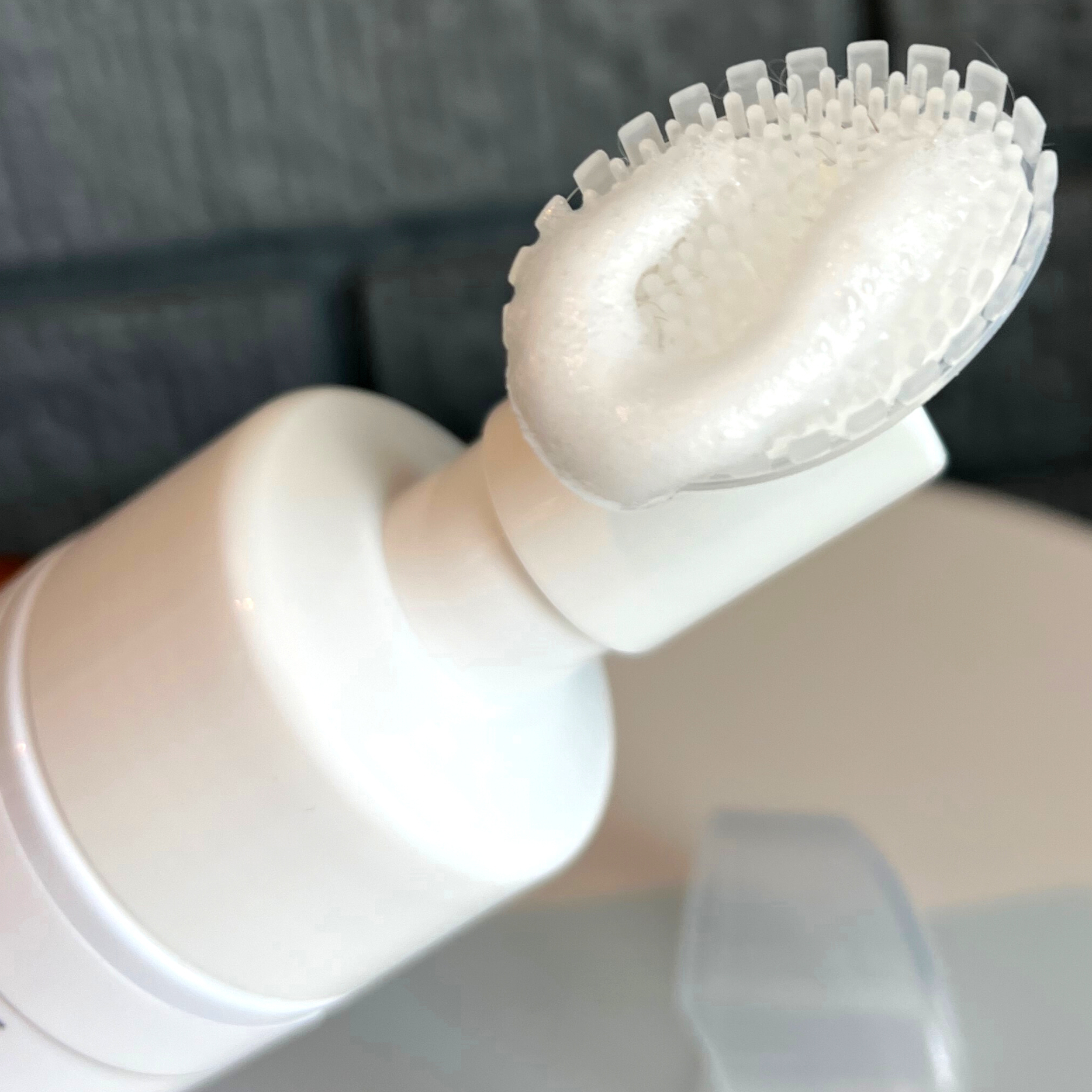 Silicone brush displaying foaming cleanser for dogs